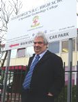 John Merry outside St George's School during the closure battle